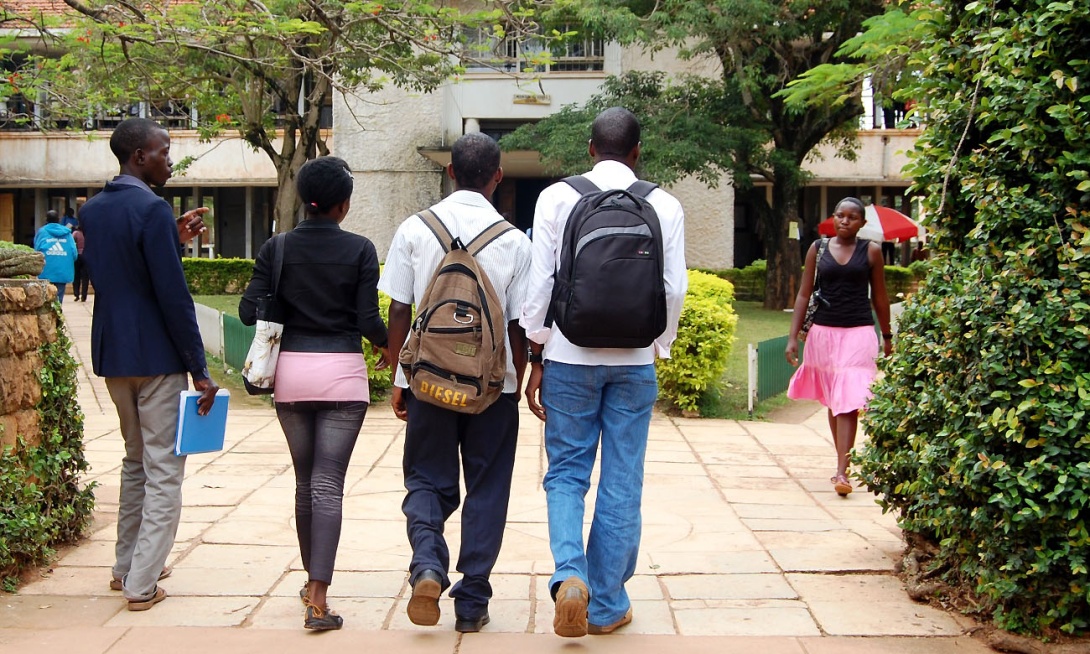 Students walk into the Arts Quadrangle, College of Humanities and Social Sciences, Makerere University, Kampala Uganda.