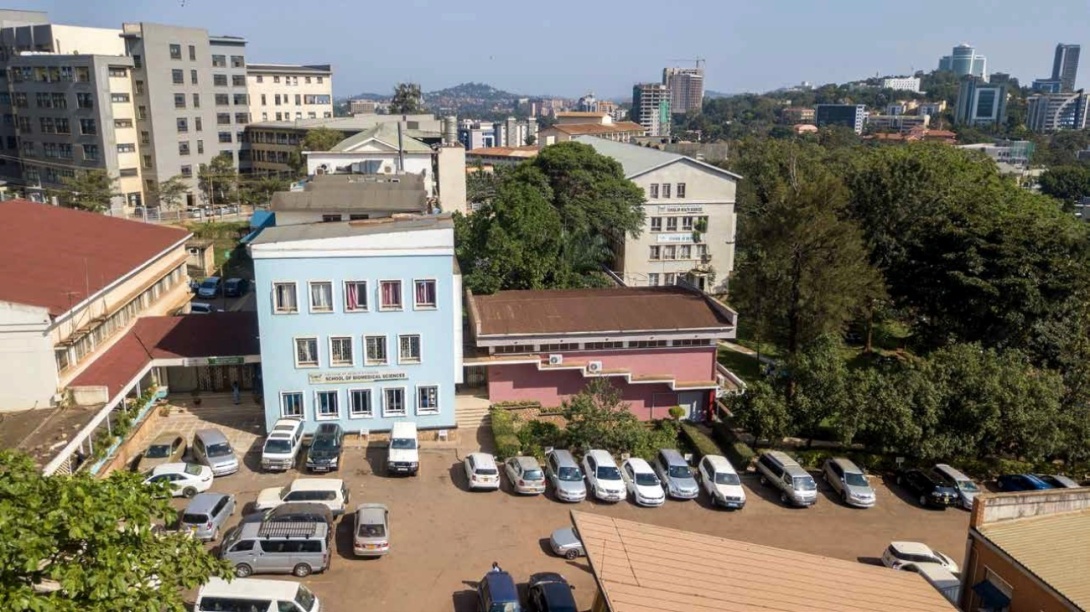 An aerial photo of the College of Health Sciences (CHS), Makerere University, Kampala Uganda, East Africa showing Left to Right: The Sir Albert Cook Memorial Library, School of Biomedical Sciences, Davies Lecture Theatre, School of Public Health, Mulago Specialised Women and Neonatal Hospital (MSWNH)-Background Left and Nakasero Hill-Background Right.