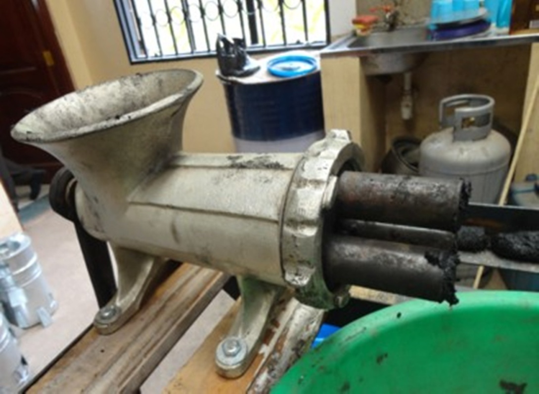 A Briquette Making Machine at the Centre for Research in Energy and Energy Conservation (CREEC), College of Engineering, Desing, Art, and Technology (CEDAT), Makerere University, Kampala Uganda, East Africa.