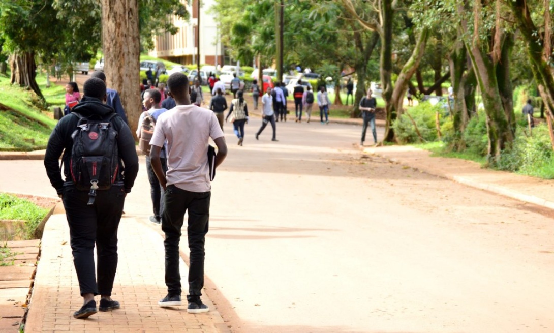 Students walk along Lincoln Close on the Main Campus, Makerere University, Kampala Uganda, East Africa.