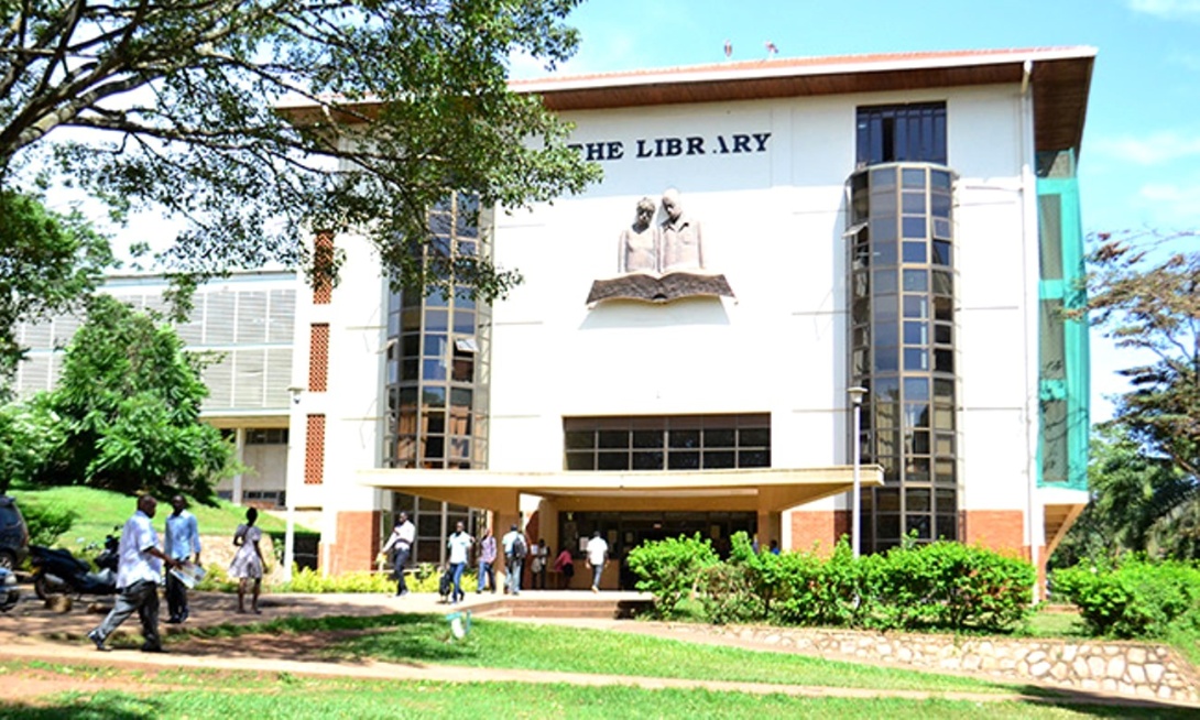 Users walk in and out of the entrance of the Main Library, Makerere University, Kampala Uganda, East Africa. 