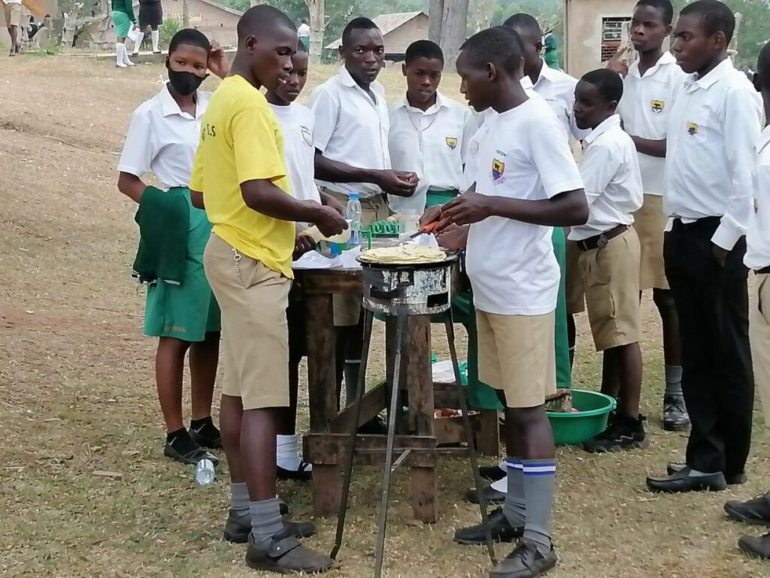 Mityana SS students at the chapati making stand as part of the Imparting Entrepreneurship Skills in Universal Secondary Education Learners through Student Training for Entrepreneurial Promotion project supported by Makerere University Research and Innovations Fund (Mak-RIF).