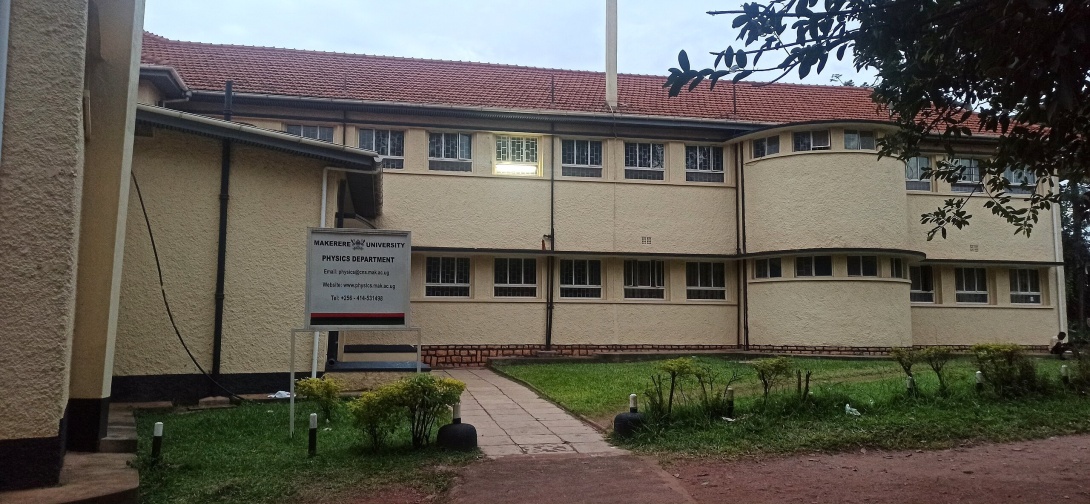 The Physics Department, College of Natural Sciences (CoNAS), Makerere University, Kampala Uganda at dusk. Photo by Zahara5555, CC BY-SA 4.0 <https://creativecommons.org/licenses/by-sa/4.0>, via Wikimedia Commons